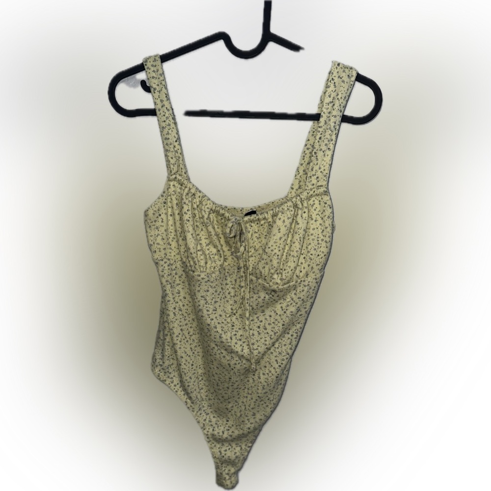 yellow with blue flower body suit